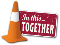 In this together sign and orange cone