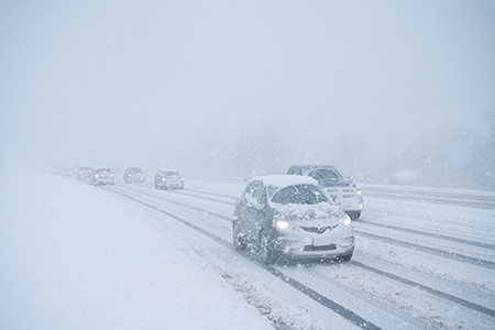 Cars driving during whiteout conditions