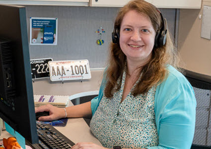 DMV call center woman with headphones ready to help