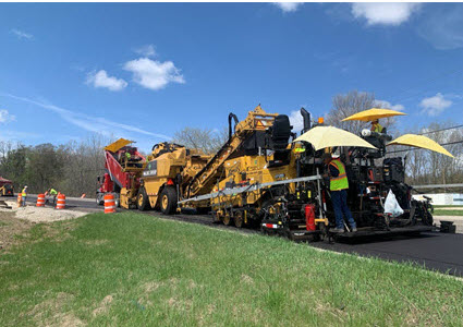 Paving equipment on sunny day
