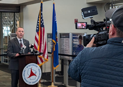 WisDOT exec being video recorded by TV station camerman