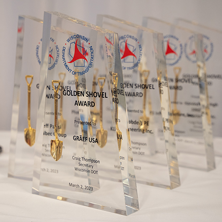 Golden Shovel Awards on a table