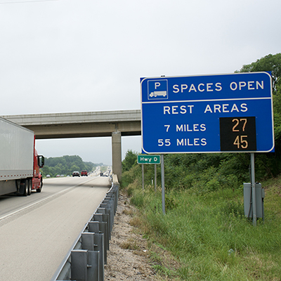 Available truck parking sign next to highway