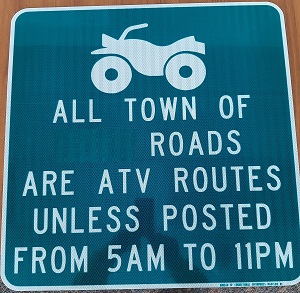 Improper D11-10A sign with hours of operation