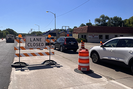 Traffic in a work zone near a local business