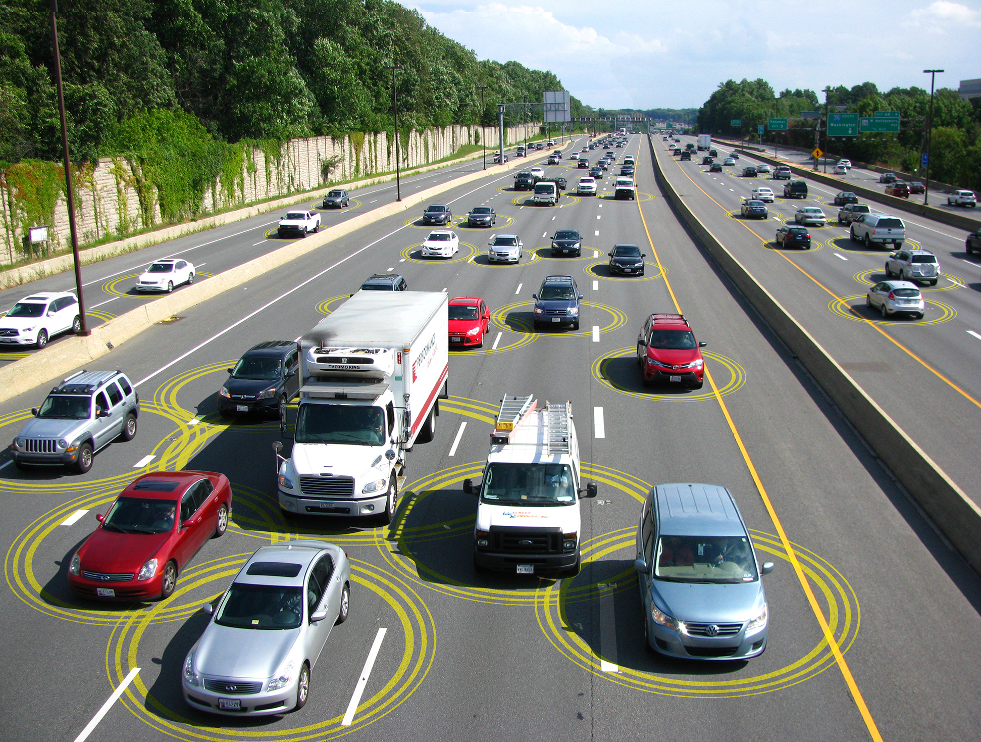 Photo of vehicles on highway communicating with one another