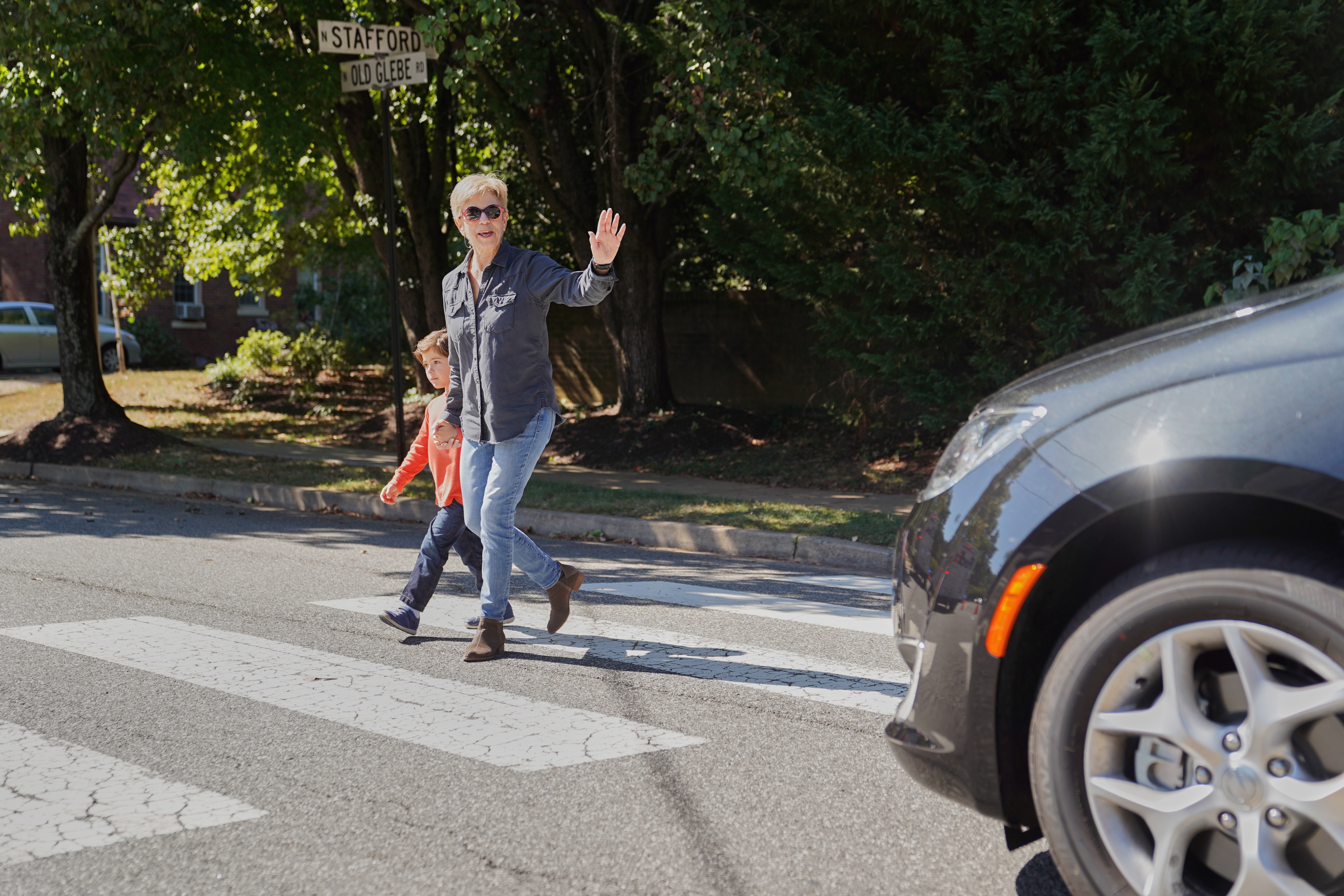 Photo illustration showing woman and child in crosswalk