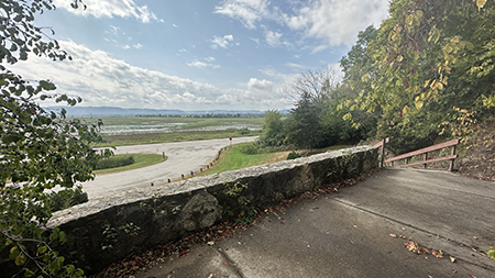 A wayside overlooks a roadway.